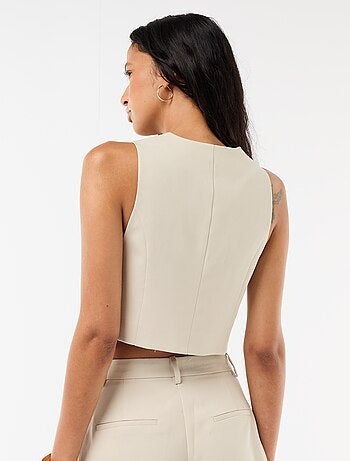 Gilet da abito con apertura asimmetrica abbottonata