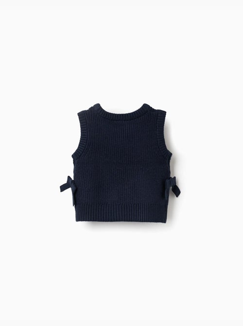Gilet in maglia con fiocchi laterali - Kiabi Gilet in maglia con fiocchi laterali - Kiabi