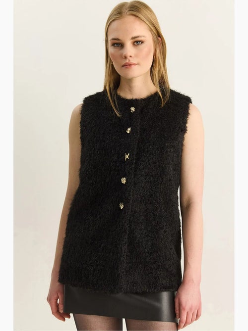 Gilet in peluche con chiusura a bottoni lucci - Kiabi Gilet in peluche con chiusura a bottoni lucci - Kiabi