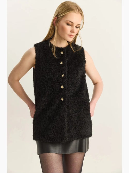 Gilet in peluche con chiusura a bottoni lucci - Kiabi Gilet in peluche con chiusura a bottoni lucci - Kiabi