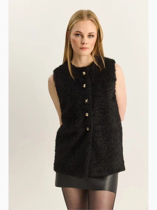 Gilet in peluche con chiusura a bottoni lucci - Kiabi Gilet in peluche con chiusura a bottoni lucci - Kiabi