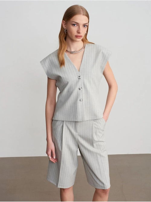Gilet in tessuto con scollo a V a righe - Kiabi Gilet in tessuto con scollo a V a righe - Kiabi