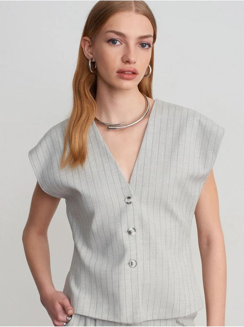 Gilet in tessuto con scollo a V a righe - Kiabi Gilet in tessuto con scollo a V a righe - Kiabi