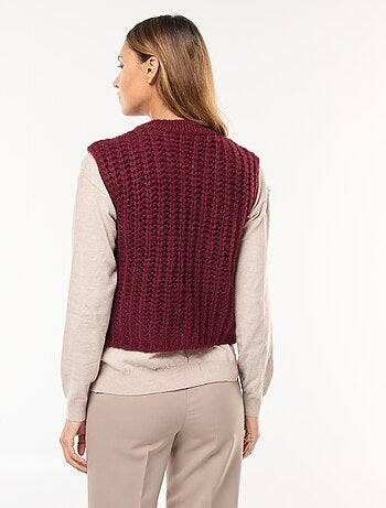 Gilet smanicato con apertura a grandi bottoni martellati