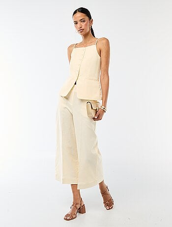 Gilet smanicato con bretelle