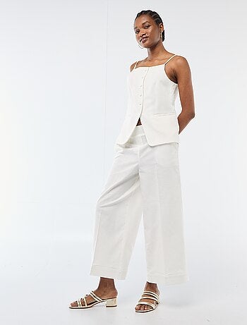 Gilet smanicato con bretelle