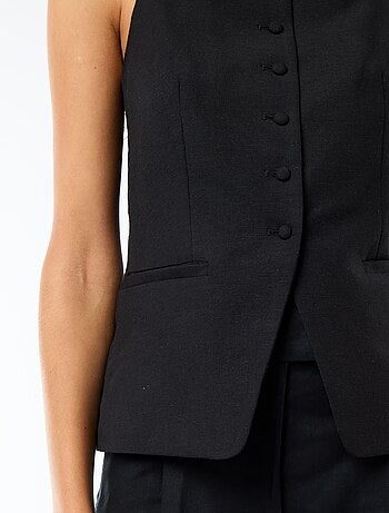 Gilet smanicato con bretelle