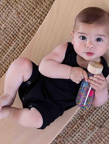 Giocattolo per neonato bottiglia sensoriale con suono | Petit Boum