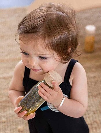 Giocattolo per neonato bottiglia sensoriale con suono | Petit Boum