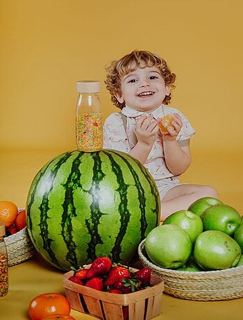 Giocattolo per neonato bottiglia sensoriale con suono | Petit Boum