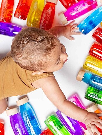 Giocattolo per neonato bottiglia sensoriale con suono | Petit Boum
