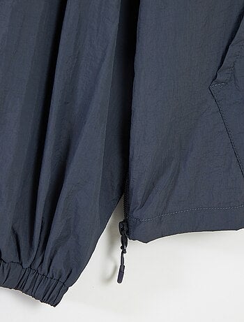 Giubbotto antipioggia con cappuccio - collezione facile da indossare