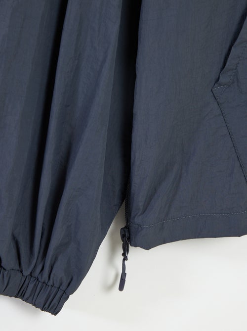 Giubbotto antipioggia con cappuccio - collezione facile da indossare - Kiabi