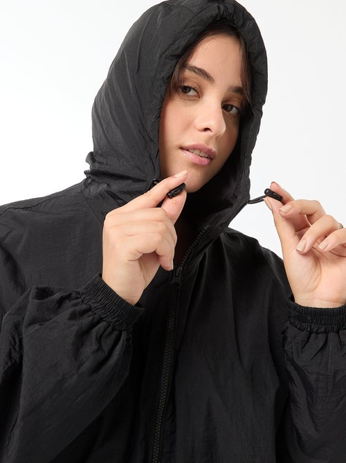 Giubbotto antivento impermeabile con cappuccio - Kiabi