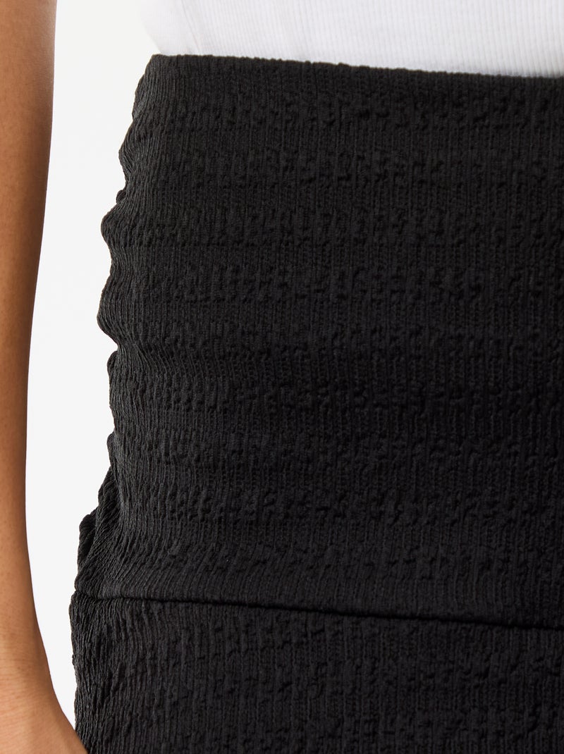Gonna corta a balze in maglia crinckle Nero - Kiabi