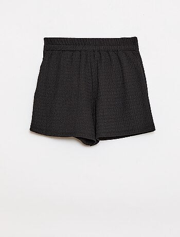 Gonna-pantaloncino corta in maglia leggera a tinta unita