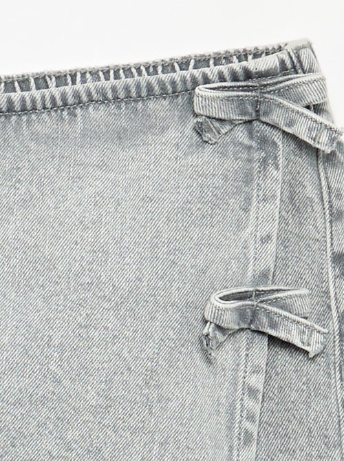 Gonna pantaloncino corto in denim con nodi - Kiabi Gonna pantaloncino corto in denim con nodi - Kiabi