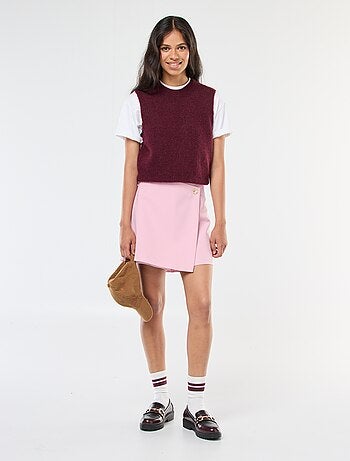 Gonna pantalone asimmetrica con bottone dorato