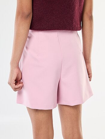 Gonna pantalone asimmetrica con bottone dorato