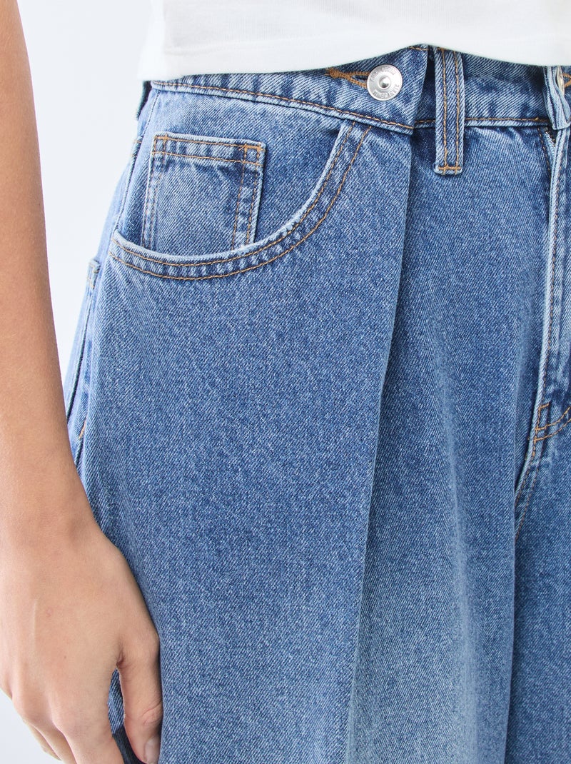 Jeans Denim Blu A Gamba Larga Con Spacchi Laterali E Fiori