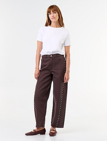 Jeans a gamba larga con borchie fantasiose