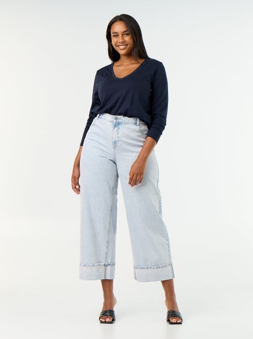 Jeans a gamba larga con risvolto alla base - Kiabi Jeans a gamba larga con risvolto alla base - Kiabi