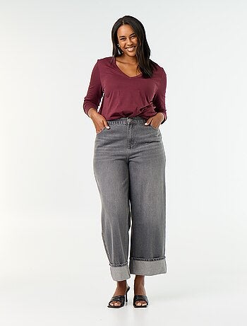 Jeans a gamba larga con risvolto alla base