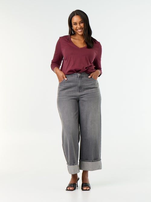 Jeans a gamba larga con risvolto alla base - Kiabi Jeans a gamba larga con risvolto alla base - Kiabi