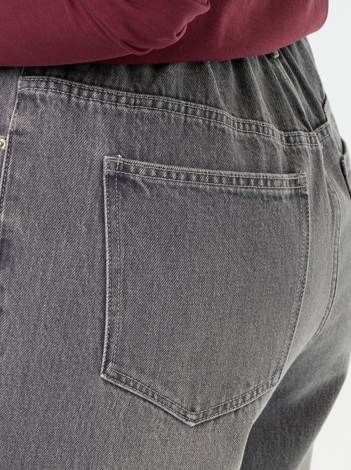 Jeans a gamba larga con risvolto alla base - Kiabi Jeans a gamba larga con risvolto alla base - Kiabi