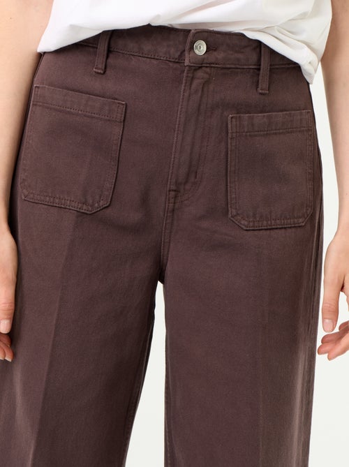 Jeans ampi a vita alta con tasche applicate - Kiabi Jeans ampi a vita alta con tasche applicate - Kiabi