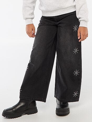 Jeans ampi con fiocchi di neve in strass