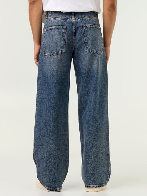 Jeans baggy a tinta unita con inserti fantasia - Kiabi Jeans baggy a tinta unita con inserti fantasia - Kiabi