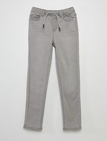 Jeans con vita elasticizzata e cordoncini