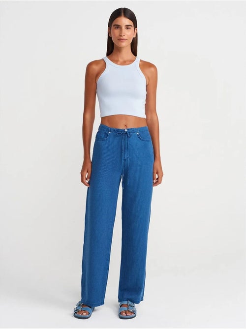 Jeans in tencel a vita media a gamba ampia a righe dilvin - Kiabi Jeans in tencel a vita media a gamba ampia a righe dilvin - Kiabi