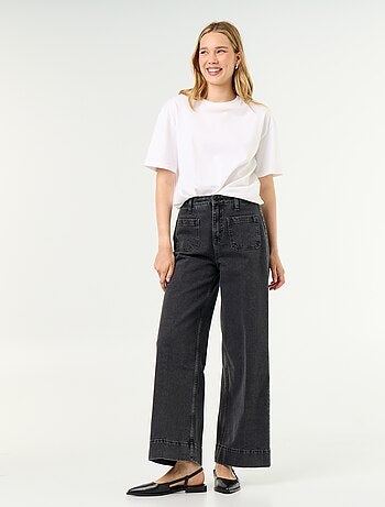 Jeans larghi a vita alta con tasche applicate