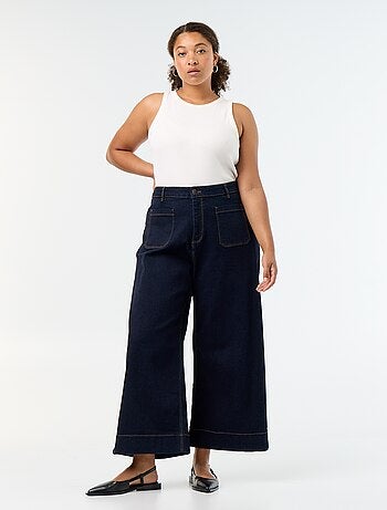 Jeans larghi con tasche applicate