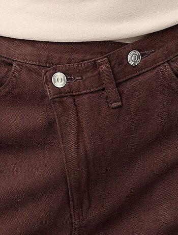 Jeans wide con abbottonatura asimmetrica