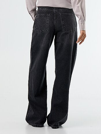 Jeans wide con abbottonatura asimmetrica