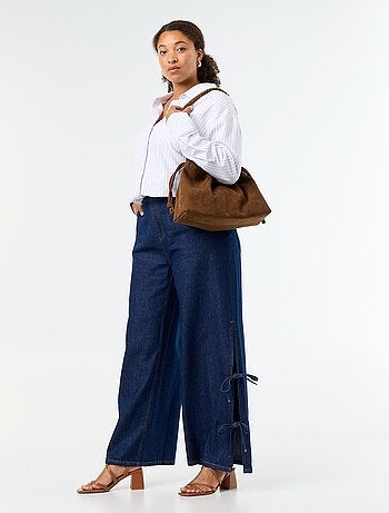 Jeans wide leg con nodi fantasia sui lati
