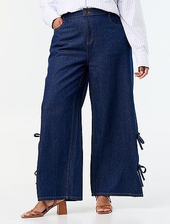 Jeans wide leg con nodi fantasia sui lati