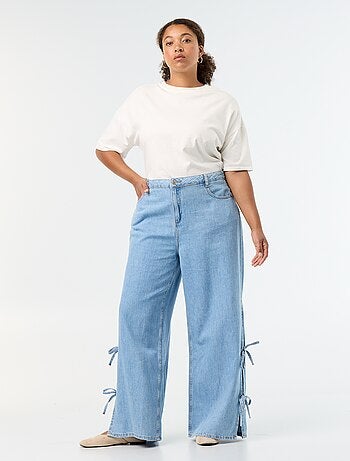 Jeans wide leg con nodi fantasia sui lati