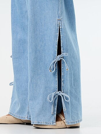Jeans wide leg con nodi fantasia sui lati
