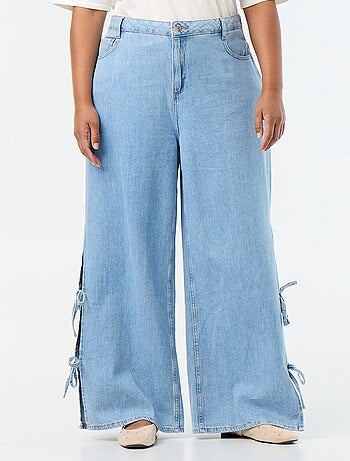 Jeans wide leg con nodi fantasia sui lati