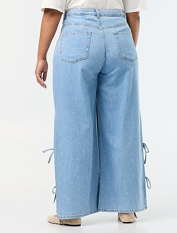 Jeans wide leg con nodi fantasia sui lati