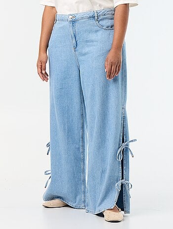 Jeans wide leg con nodi fantasia sui lati