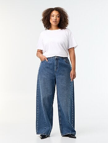 Jeans wide leg con tagli fantasia e borchie