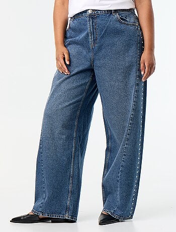 Jeans wide leg con tagli fantasia e borchie