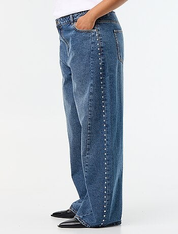 Jeans wide leg con tagli fantasia e borchie