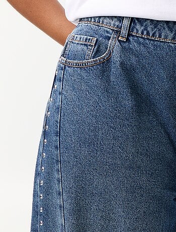 Jeans wide leg con tagli fantasia e borchie