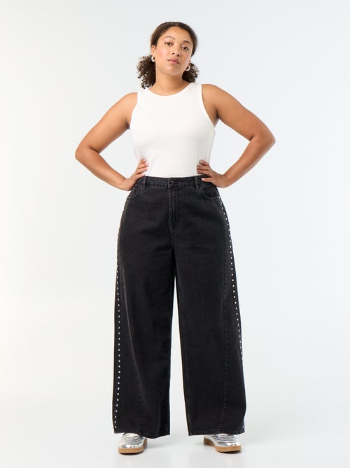 Jeans wide leg con tagli fantasia e borchie - Kiabi Jeans wide leg con tagli fantasia e borchie - Kiabi